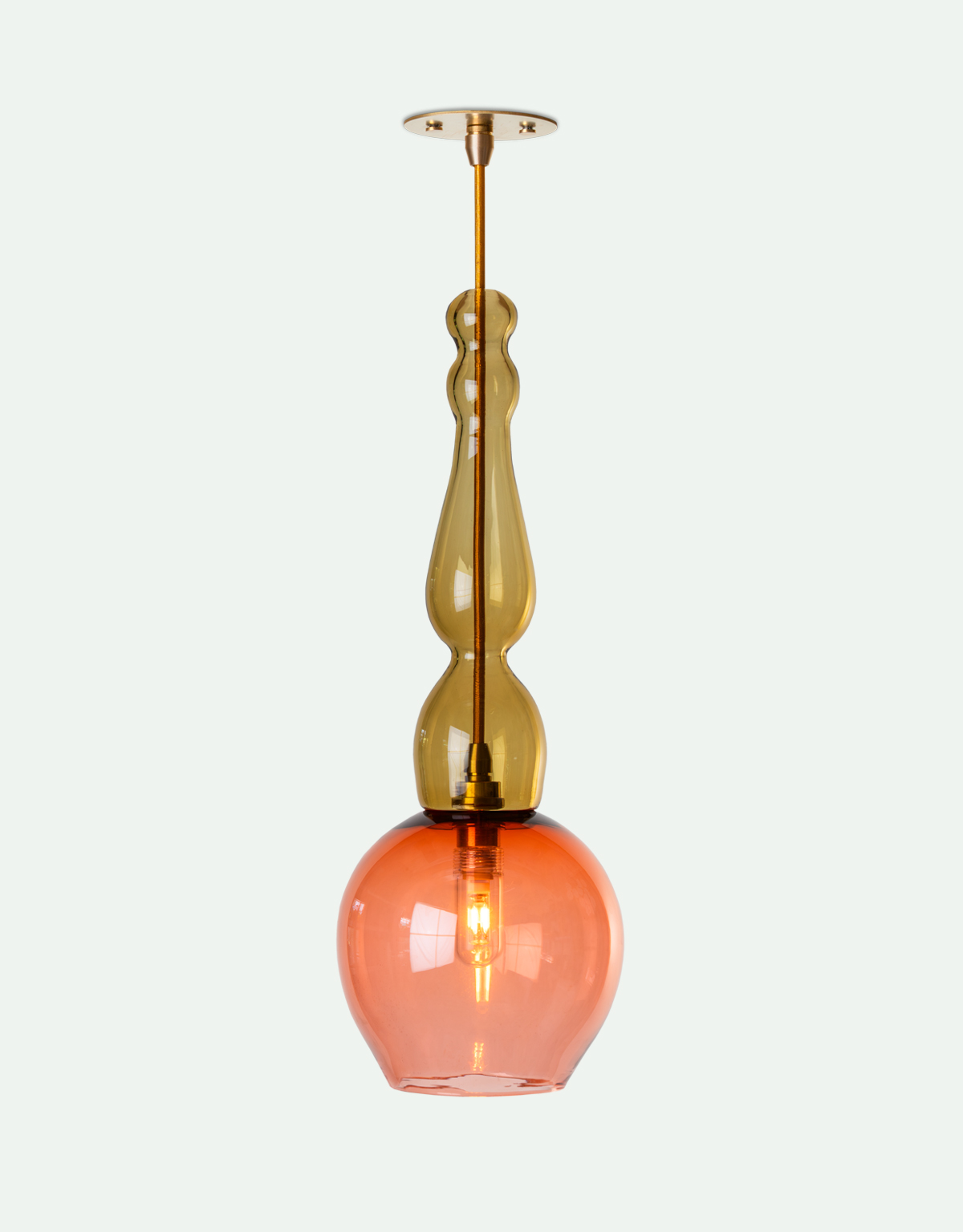 Ornate hand-blown glass pendant light for the bathroom, featuring a smoked olive green decorative stem with a blush pink round shade.
