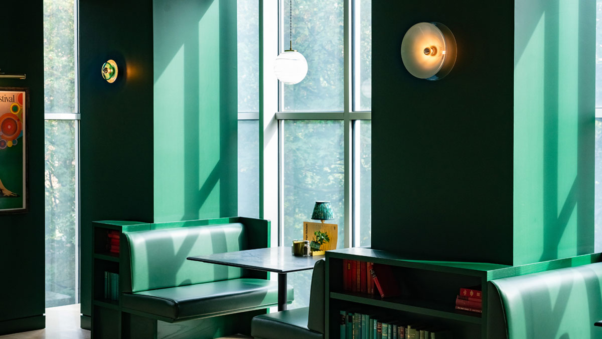 Green hand-blown glass wall lights featured at the Design Museum in London.