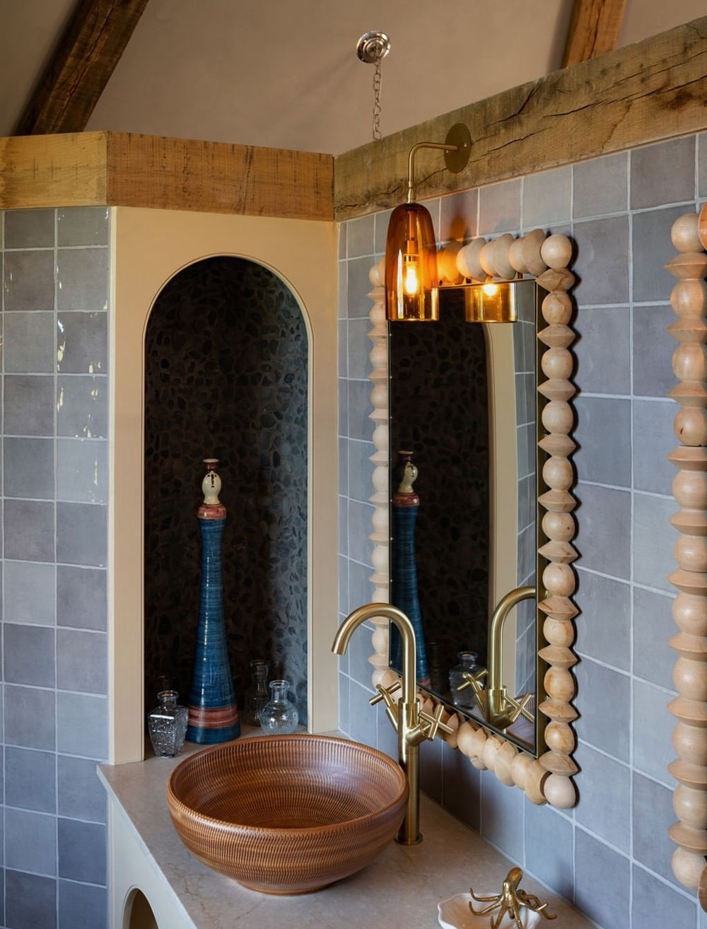 Blush pink glass wall light featured in the bathroom at Wilderness Reserve Suffolk