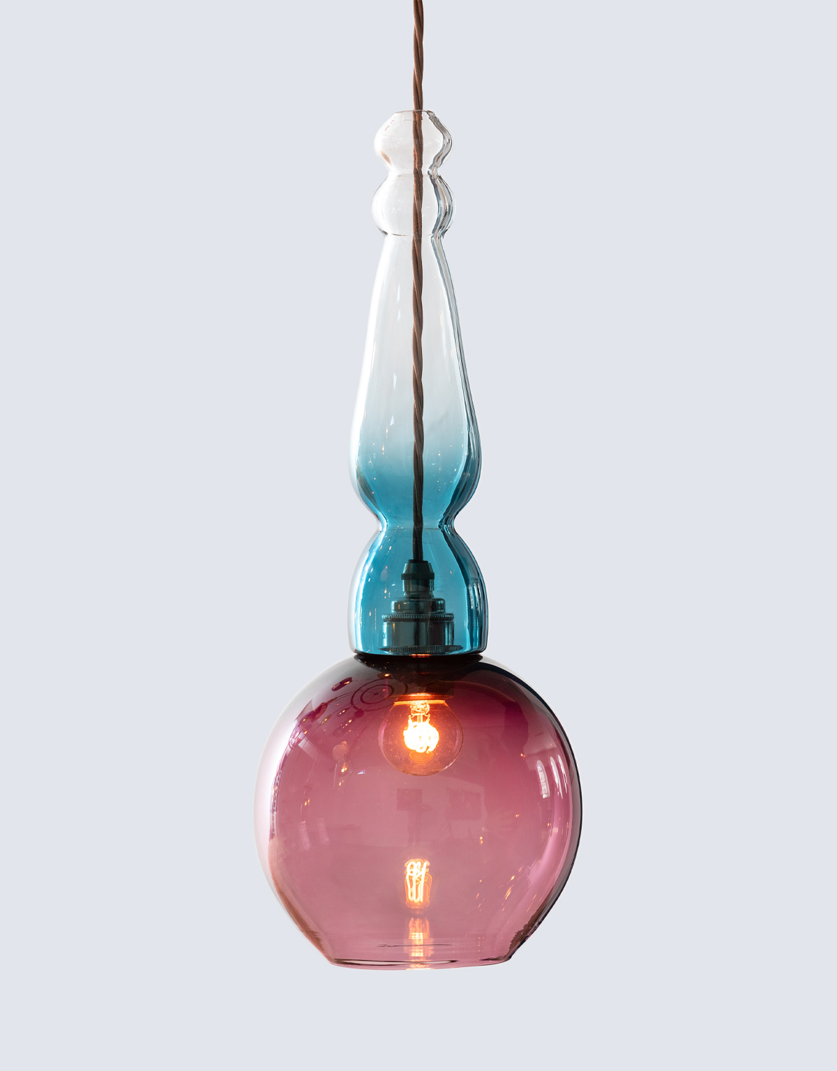 Decorative purple and blue hand-blown glass pendant light.