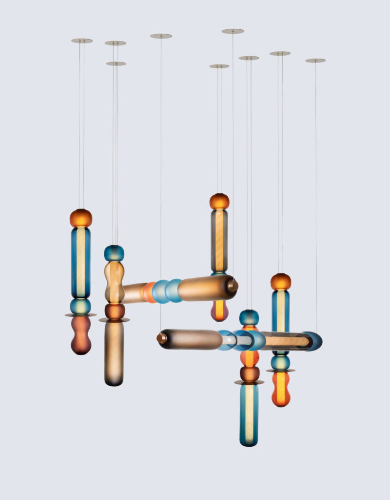 Contemporary hand-blown glass linear pendant light chandelier hand-made in the UK by Curiousa.