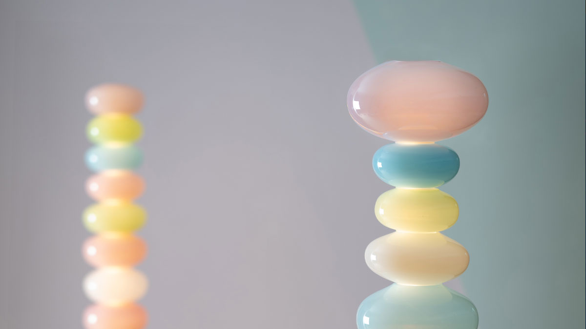 Large sculptural stacked glass floor lamp in pastel pink and blue colours. Part of the Glowbule Collection designed in collaboration with designer Adam Nathanial Furman.