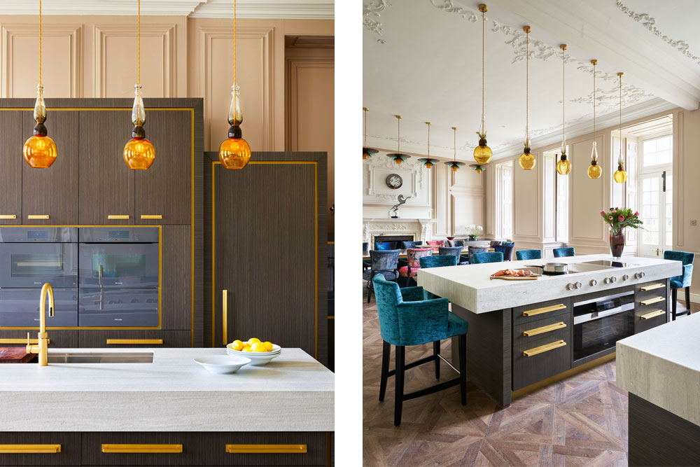 Yellow ochre hand-blown glass pendant light fixtures hanging over a contemporary kitchen island.