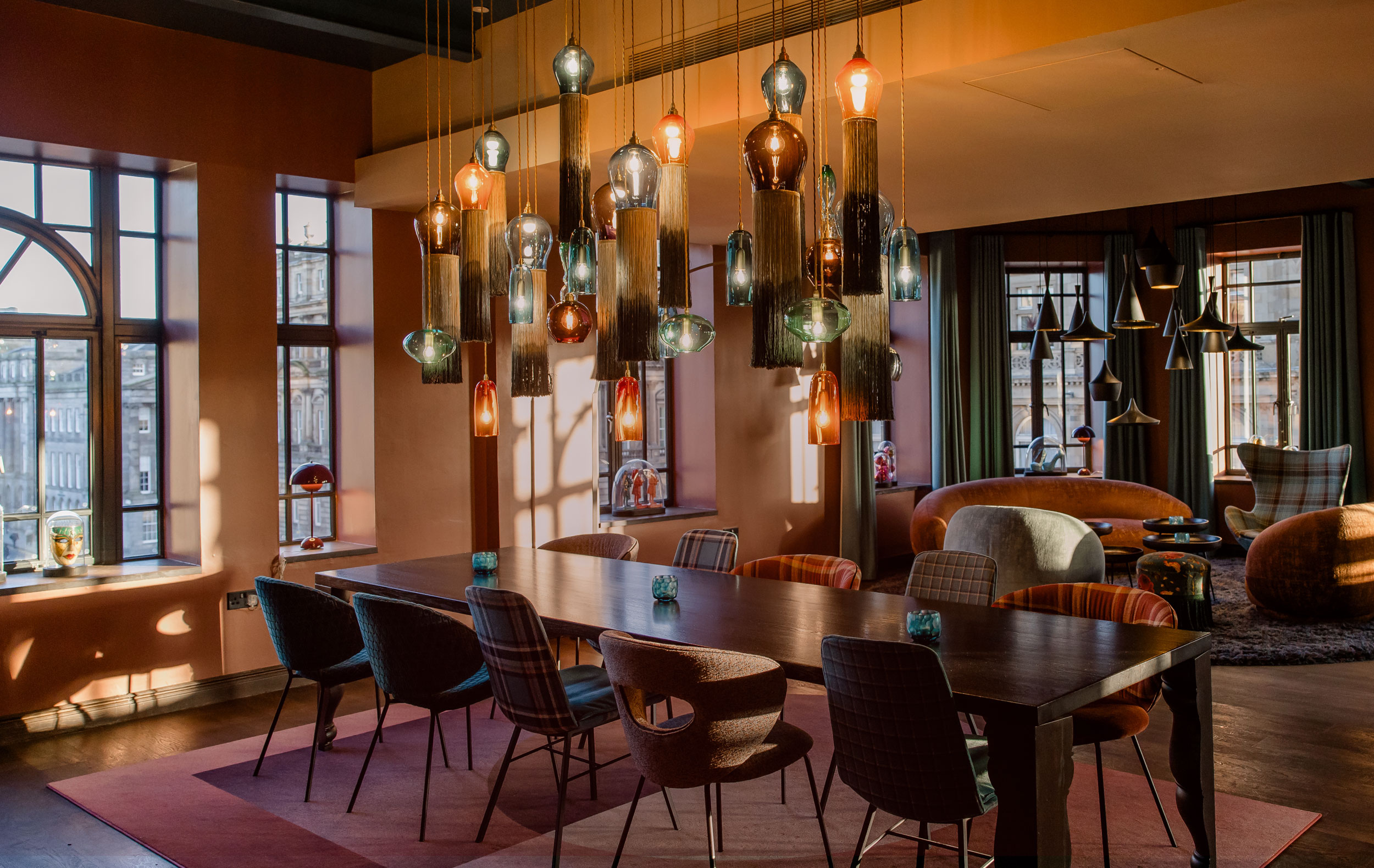 Show stopping chandelier in hotel foyer using hand blown glass and tassel creating a sumptuous statement light piece.